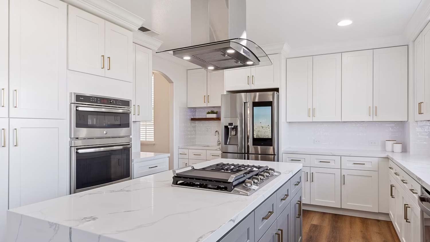 White kitchen with range hood  