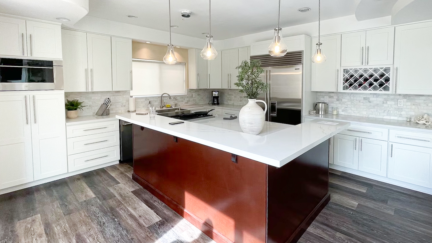 White kitchen with black island 