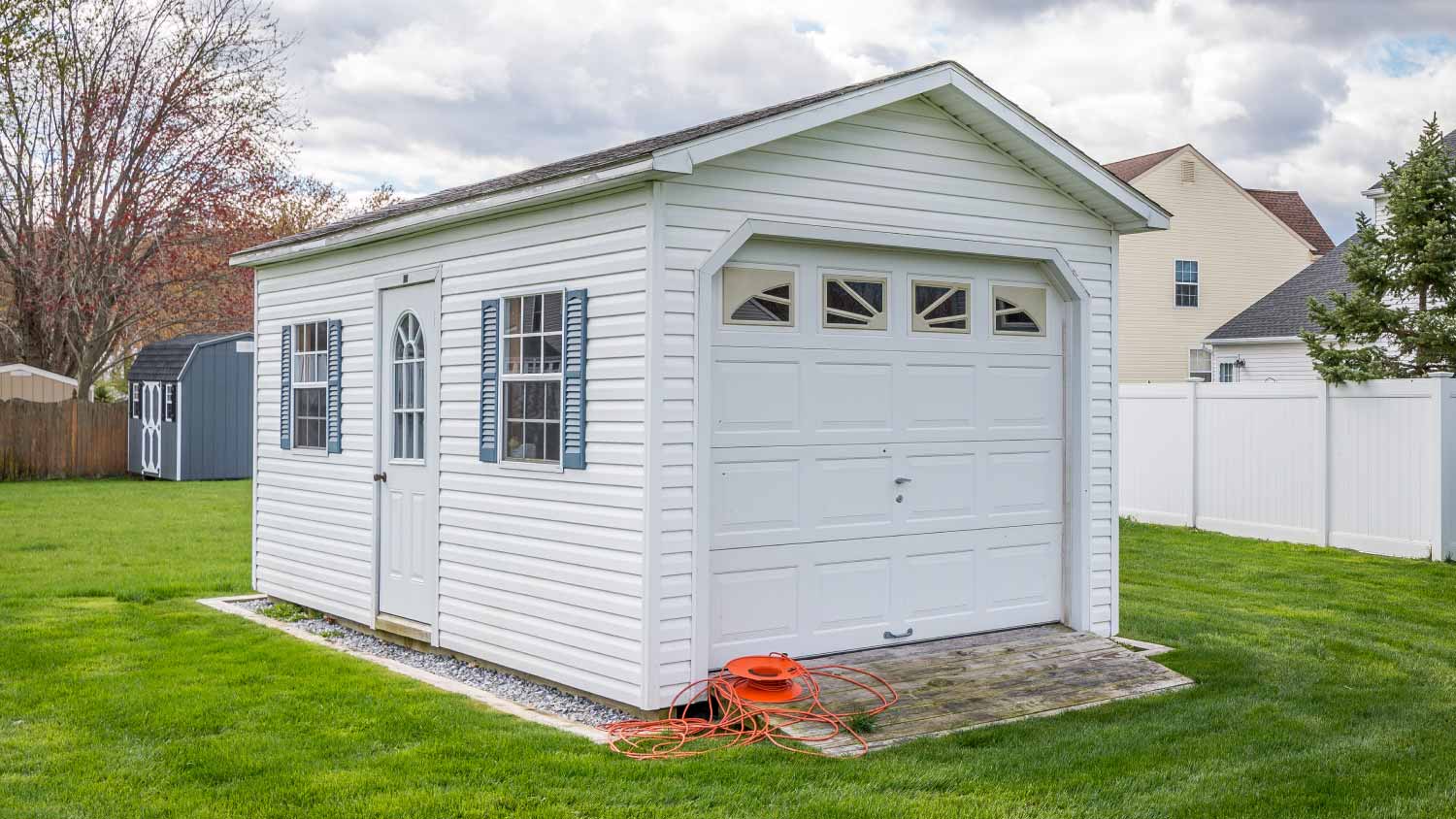 White shed on garden