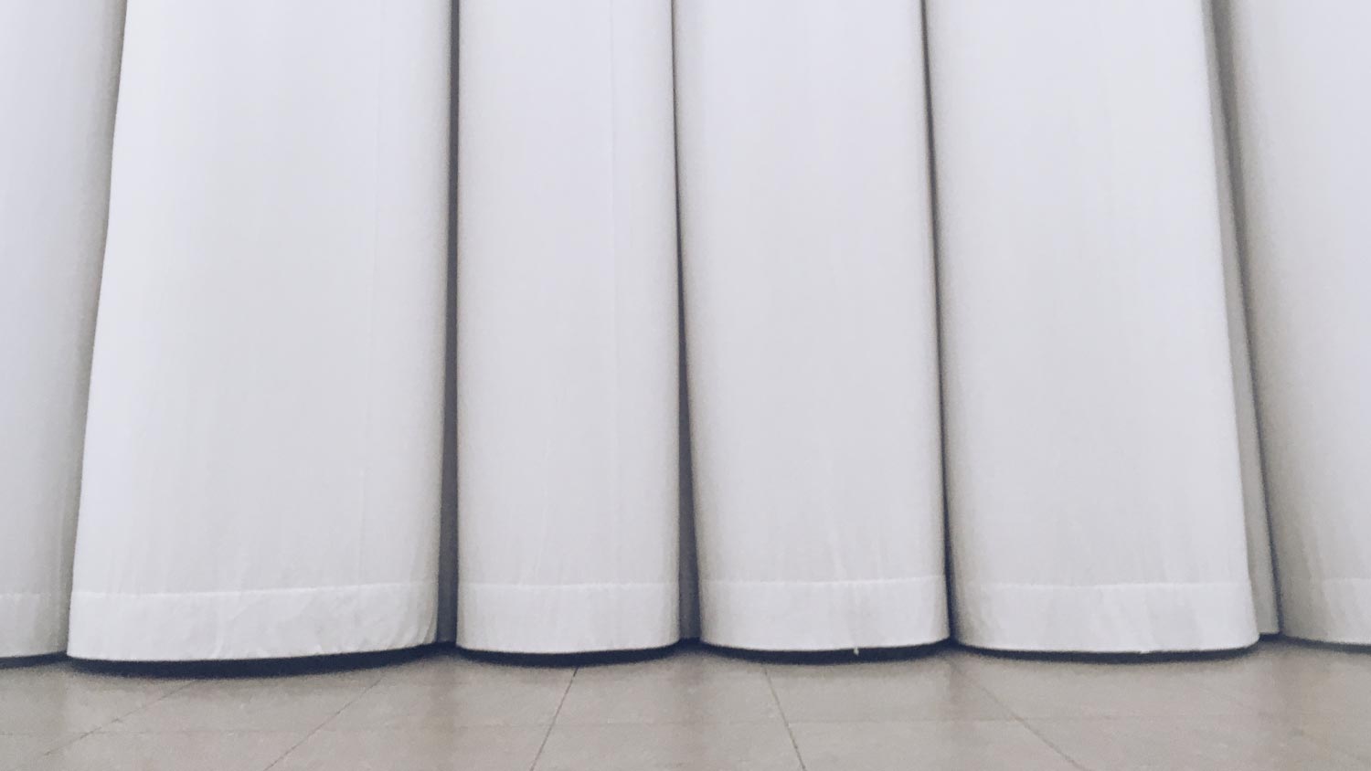 A close up of white soundproof curtains