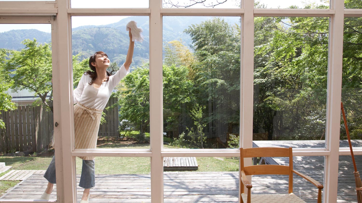 Woman cleaning windows