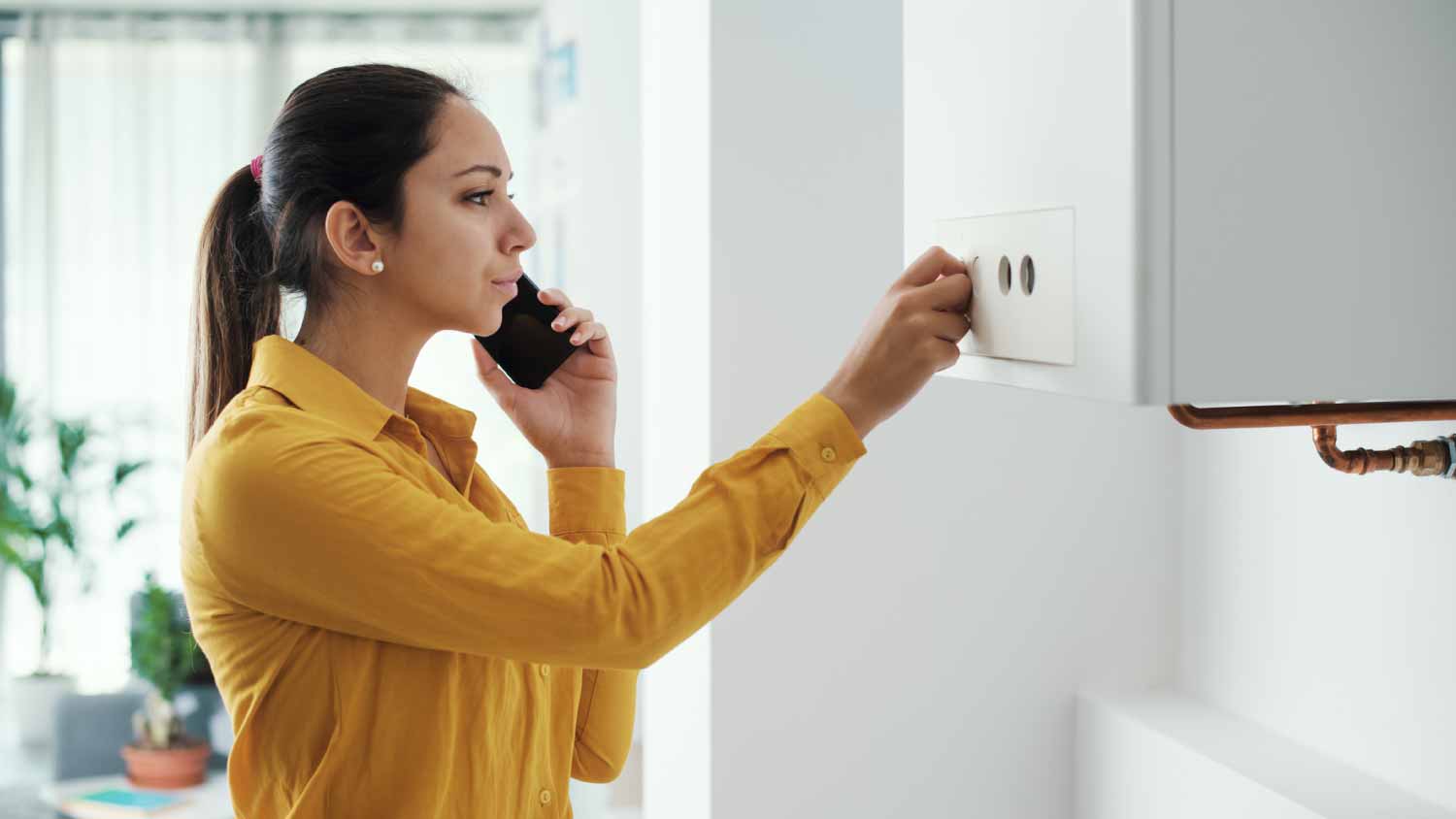 Woman calling a boiler breakdown service