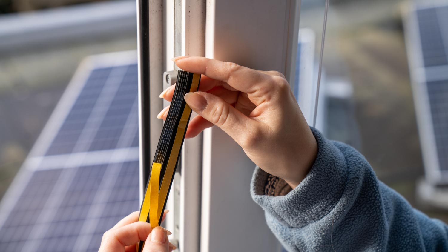 Woman installing a door gasket 