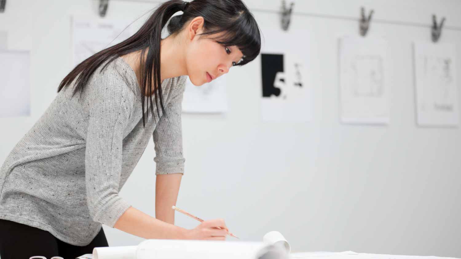 Woman looking at architectural plans