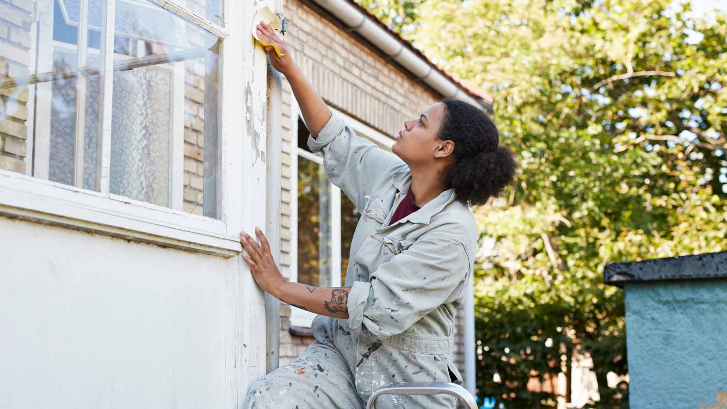 Woman scraping wall