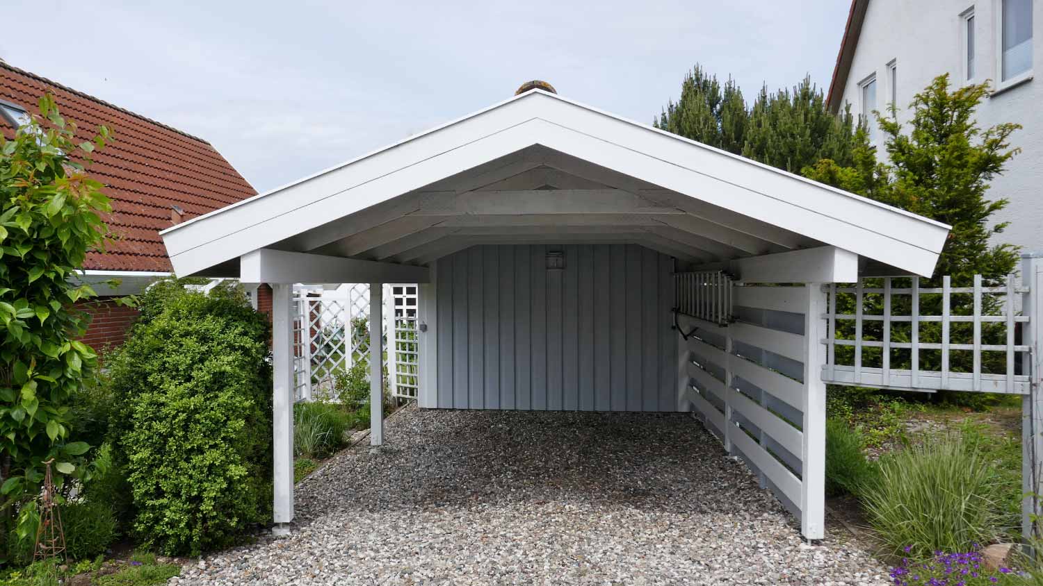 Wooden carport with pitched roof