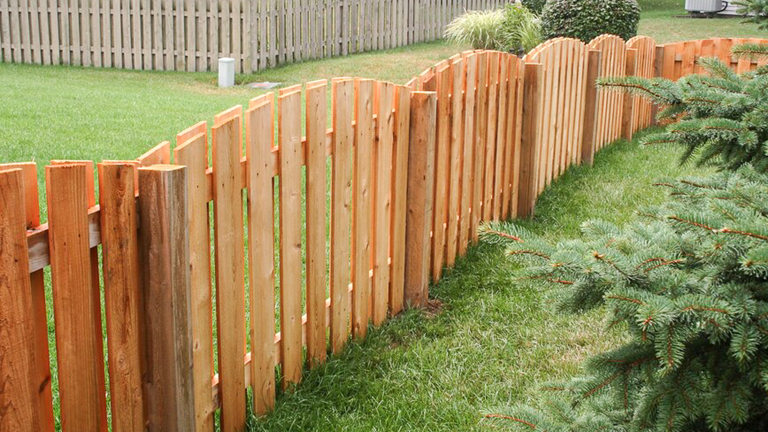 Wooden fence in large garden 