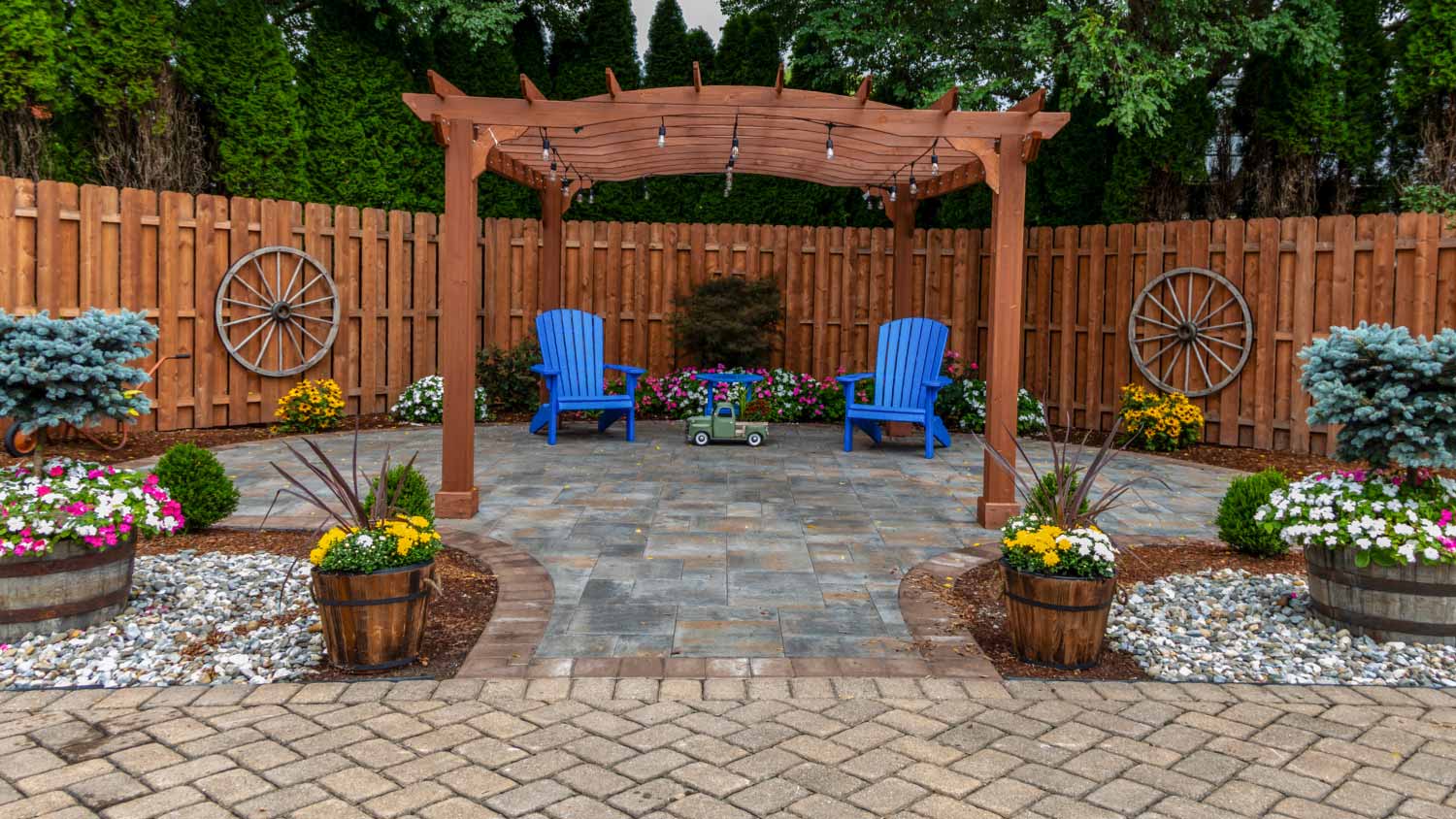 Wooden pergola on pavers landscape design