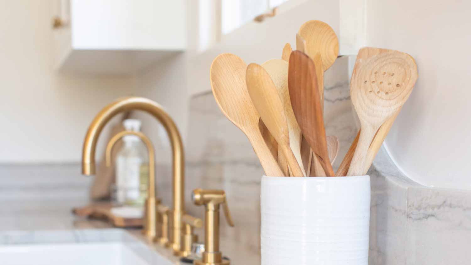 Wooden spoons in container