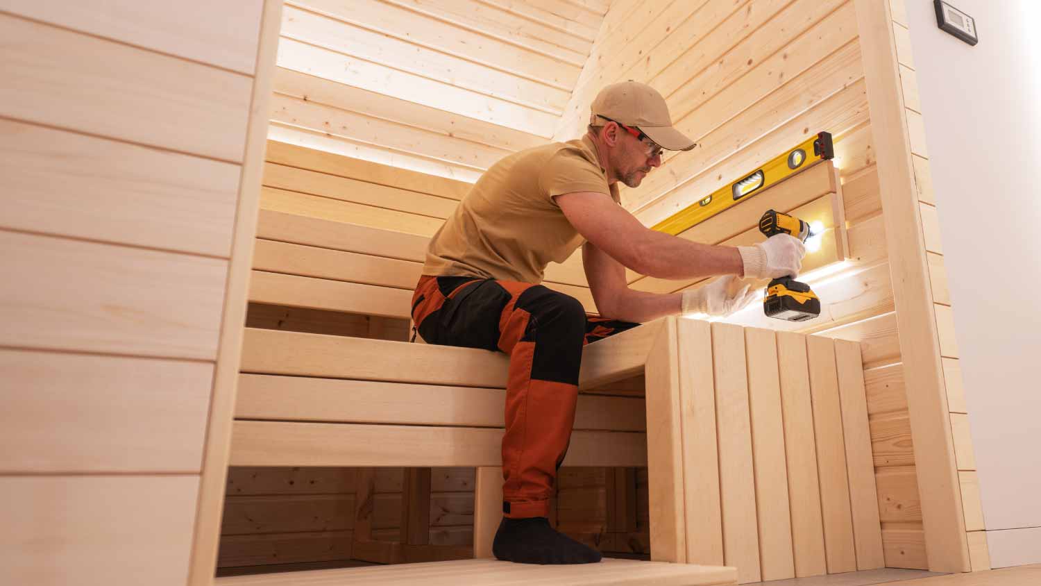 Worker building indoor sauna