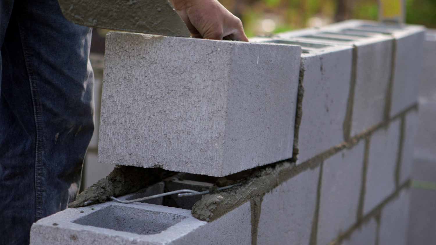Worker building a wall