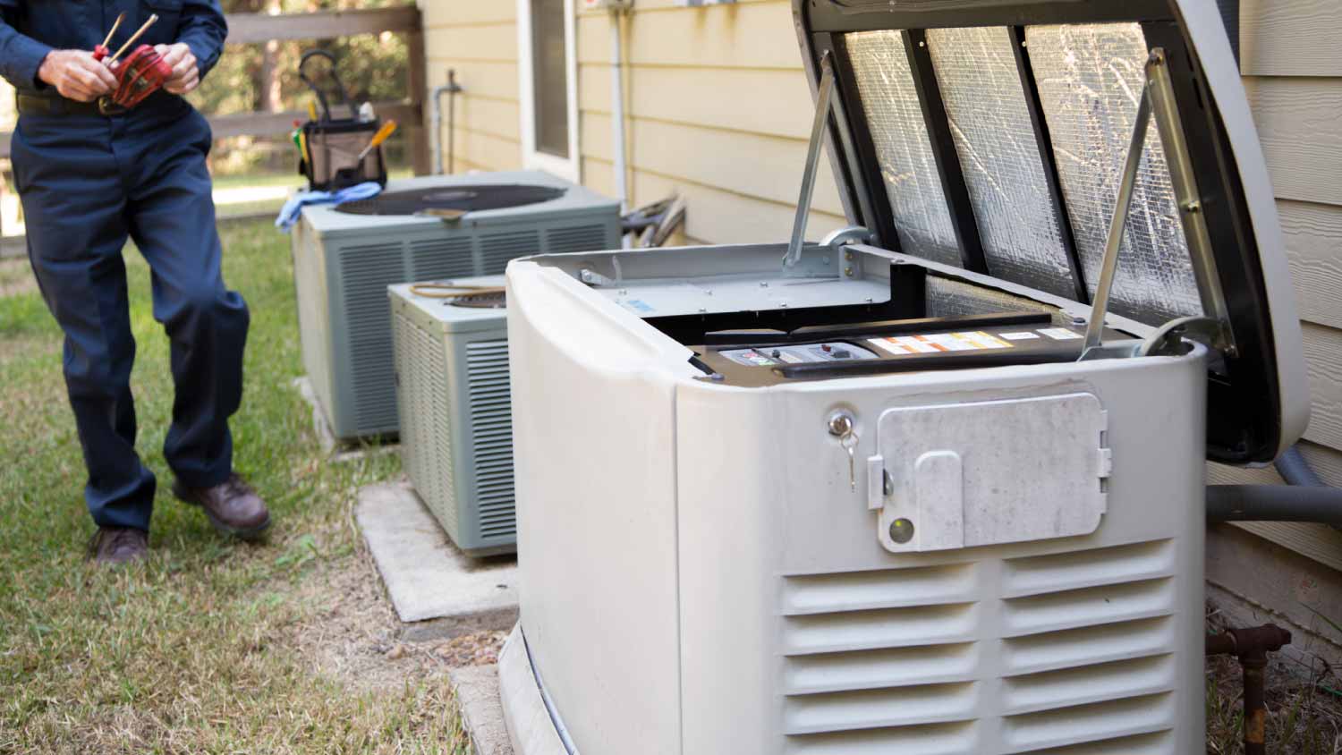 Worker checking AC units