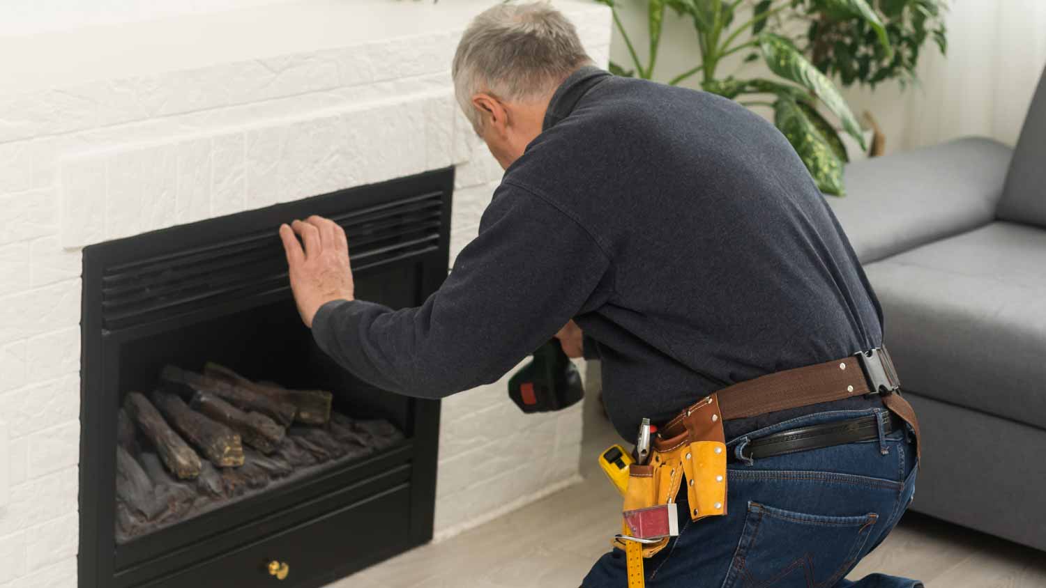 Worker checking fireplace