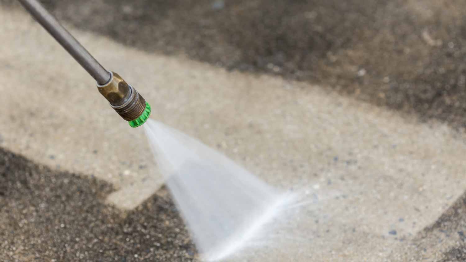 Worker cleaning with high pressure water jet