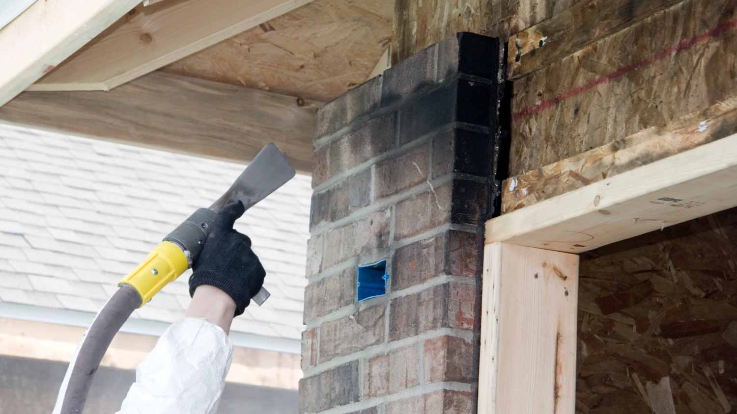 Worker cleaning smoky bricks