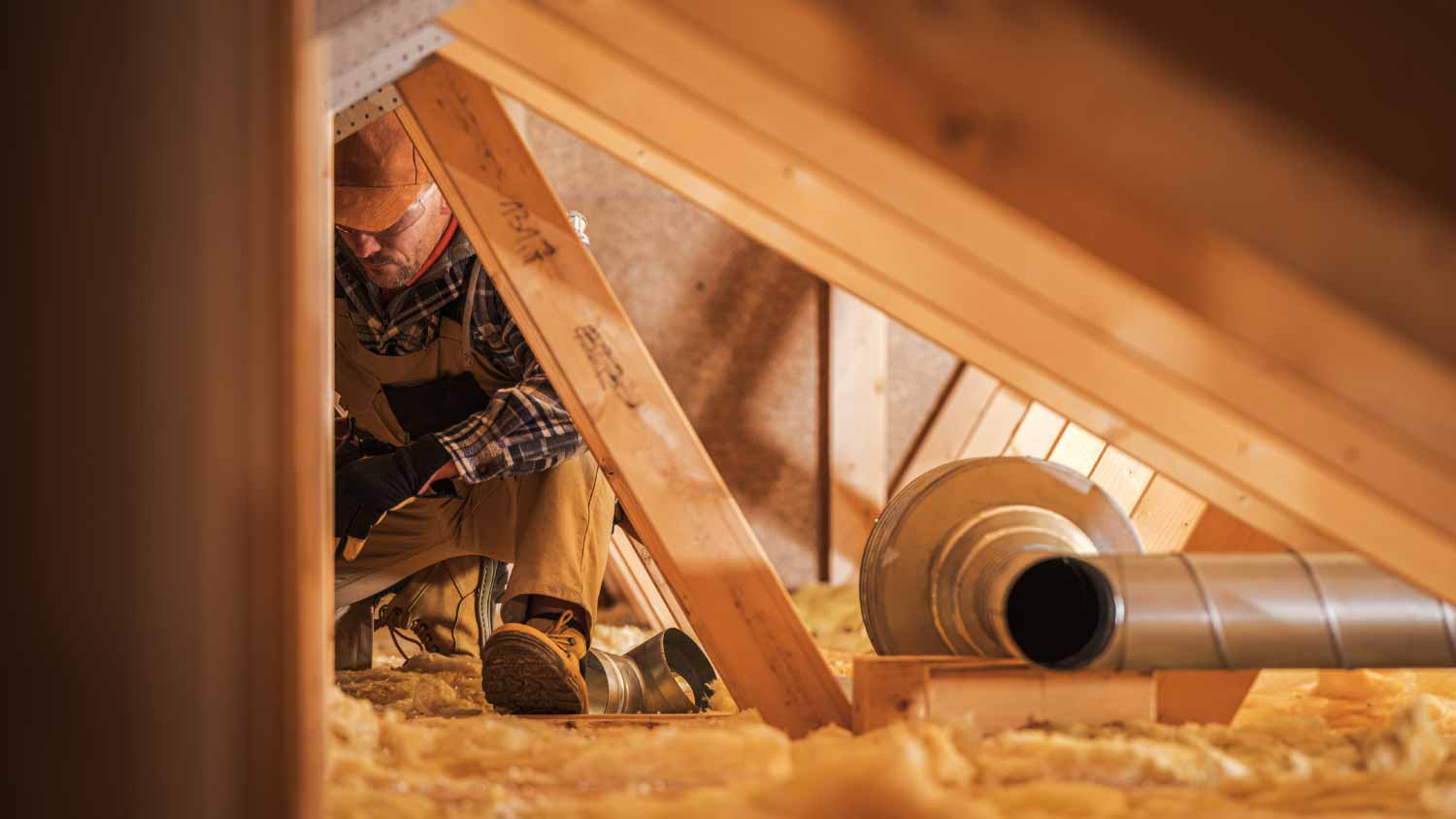 Worker installing air ventilation