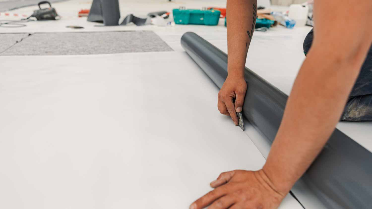 Worker installing a water resistant system