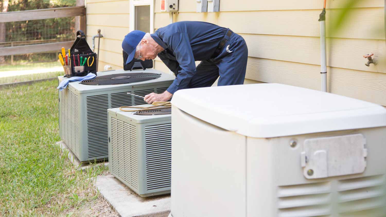 Worker opening a gas generator 