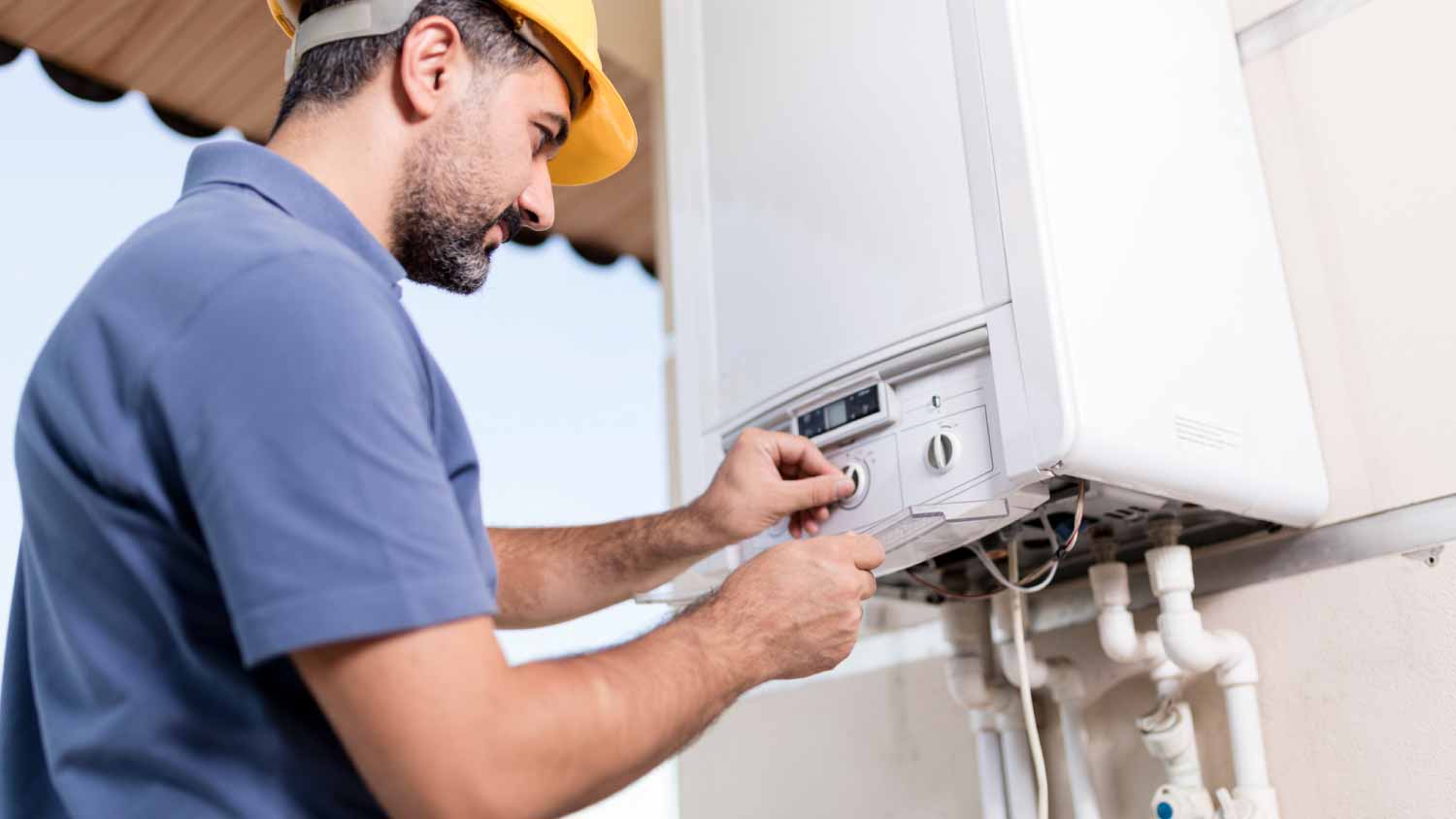 Worker repairing water heater