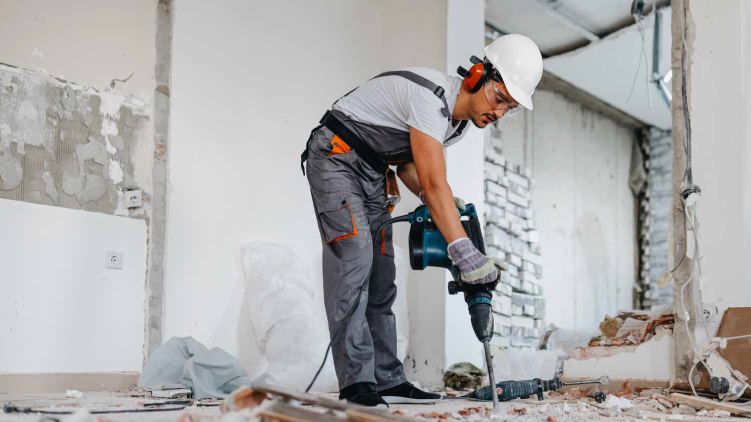 Worker using a pneumatic sledgehammer