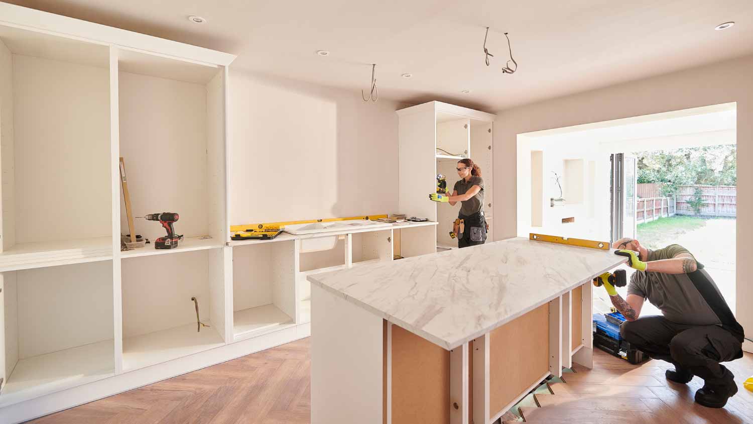 Workers doing a kitchen installation