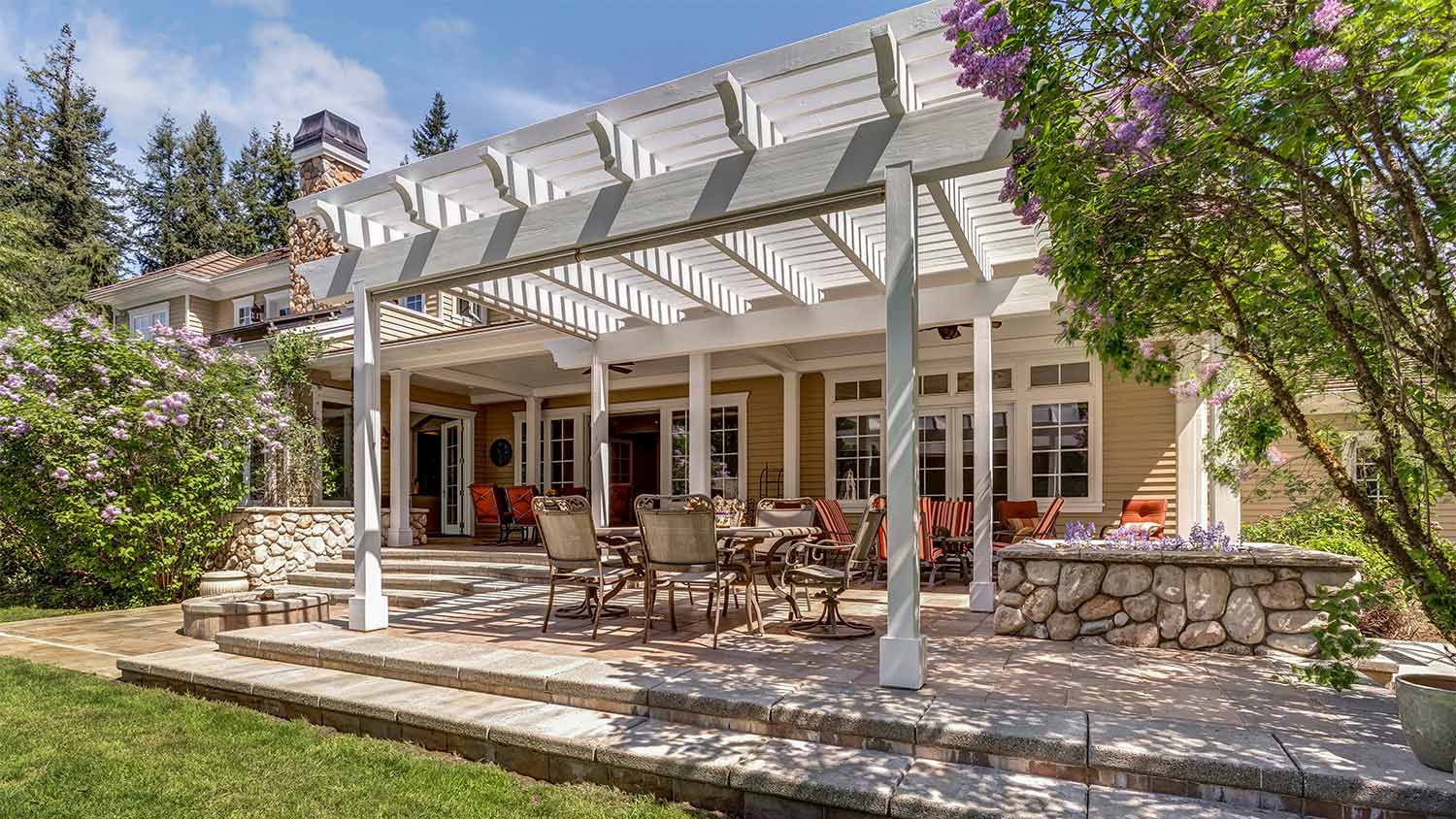 Backyard pergola patio with furniture