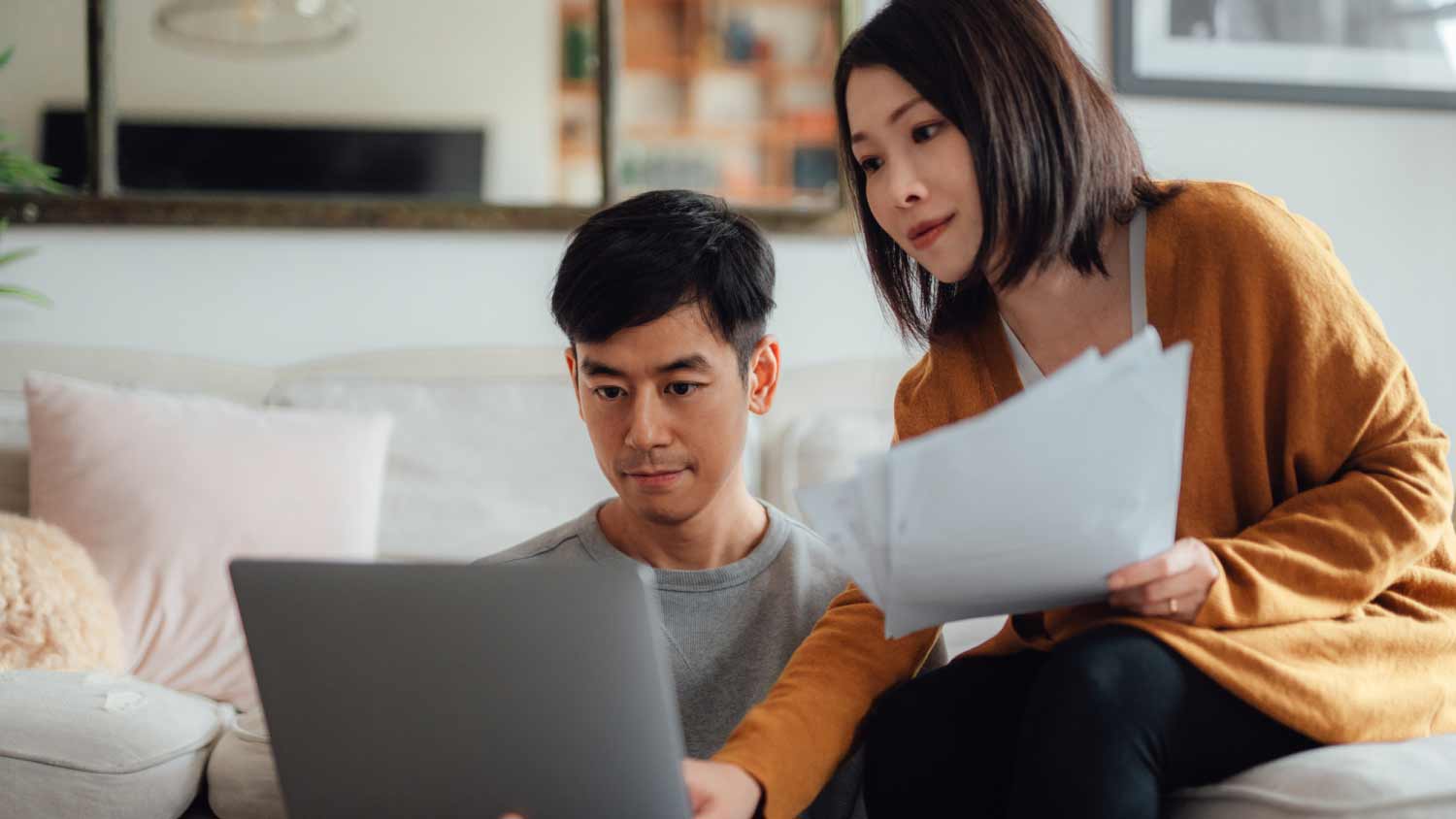 Young couple discussing over financial bills