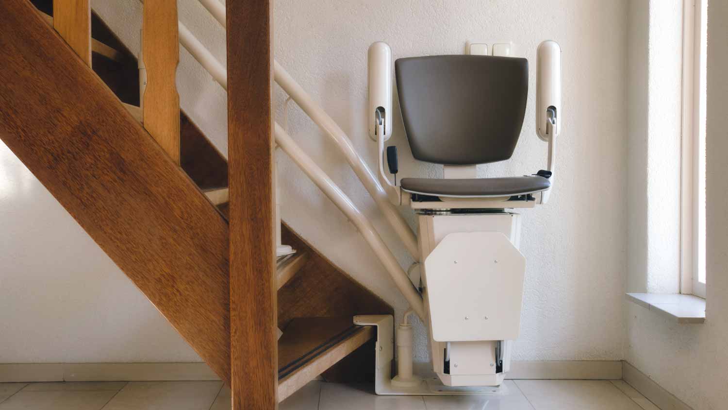 Automatic stair lift on staircase