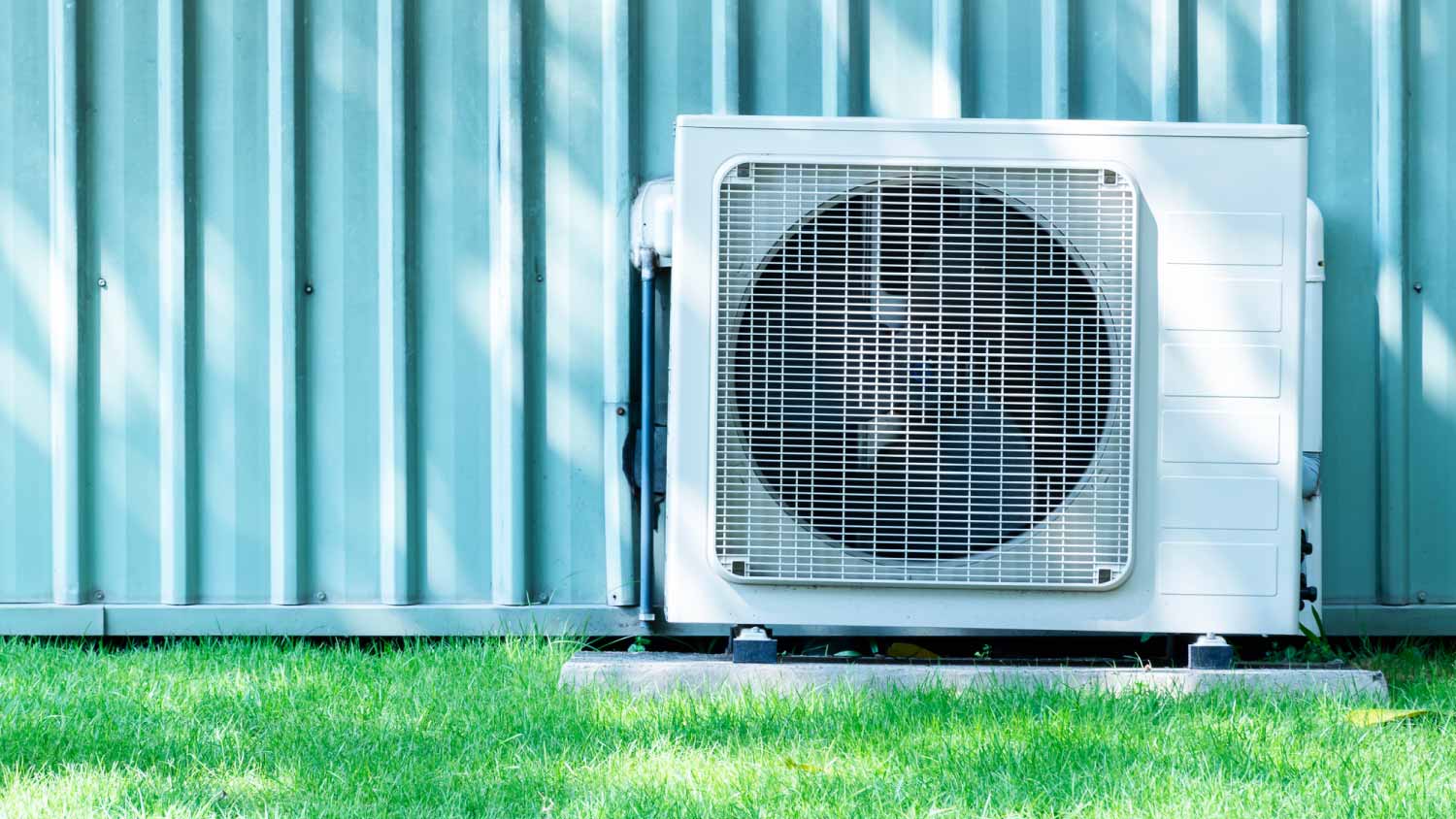 Compressor air conditioner on grass field