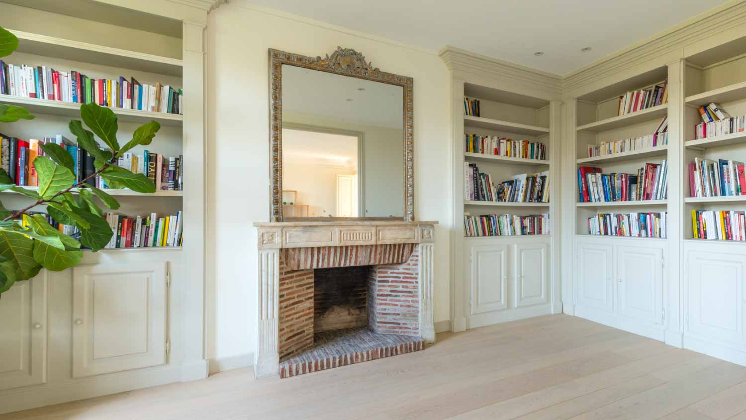 Large fireplace and a bookshelf