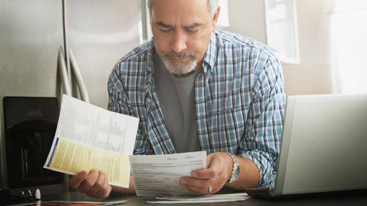 Man checking bills