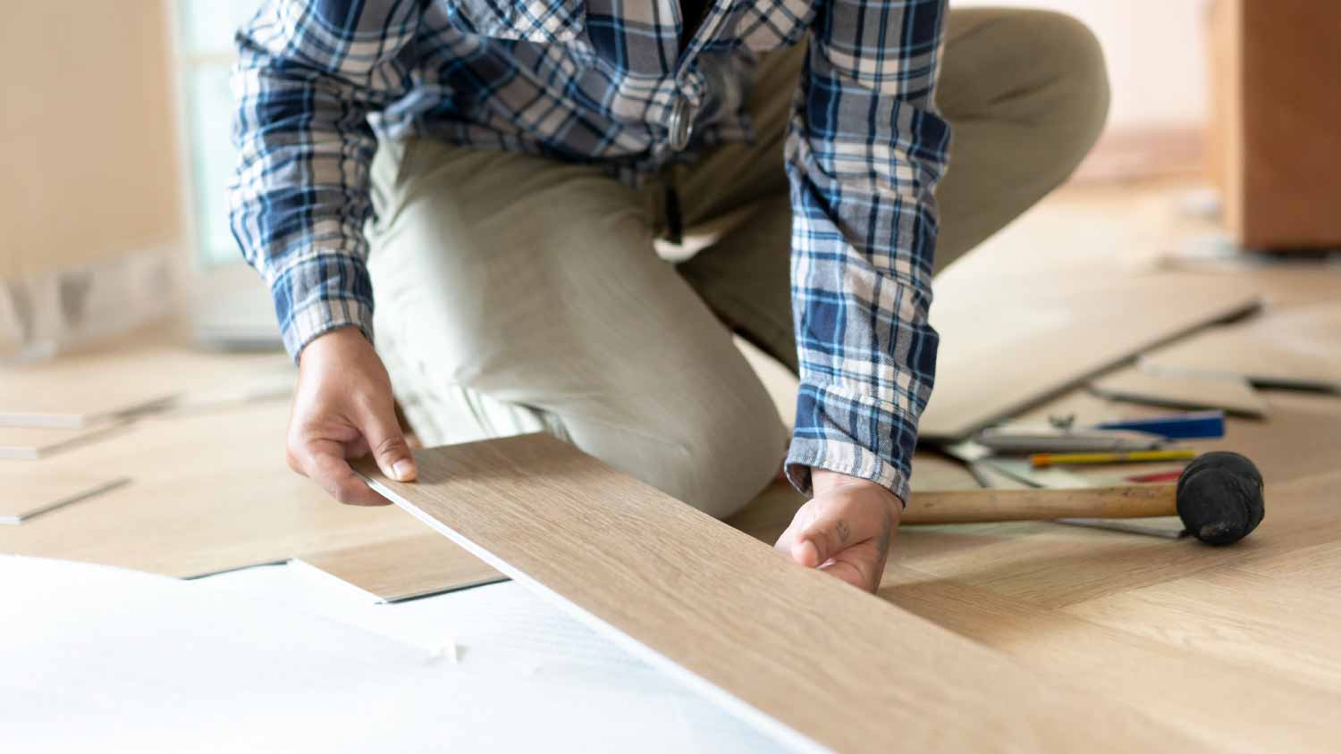 Man installing parquet floor