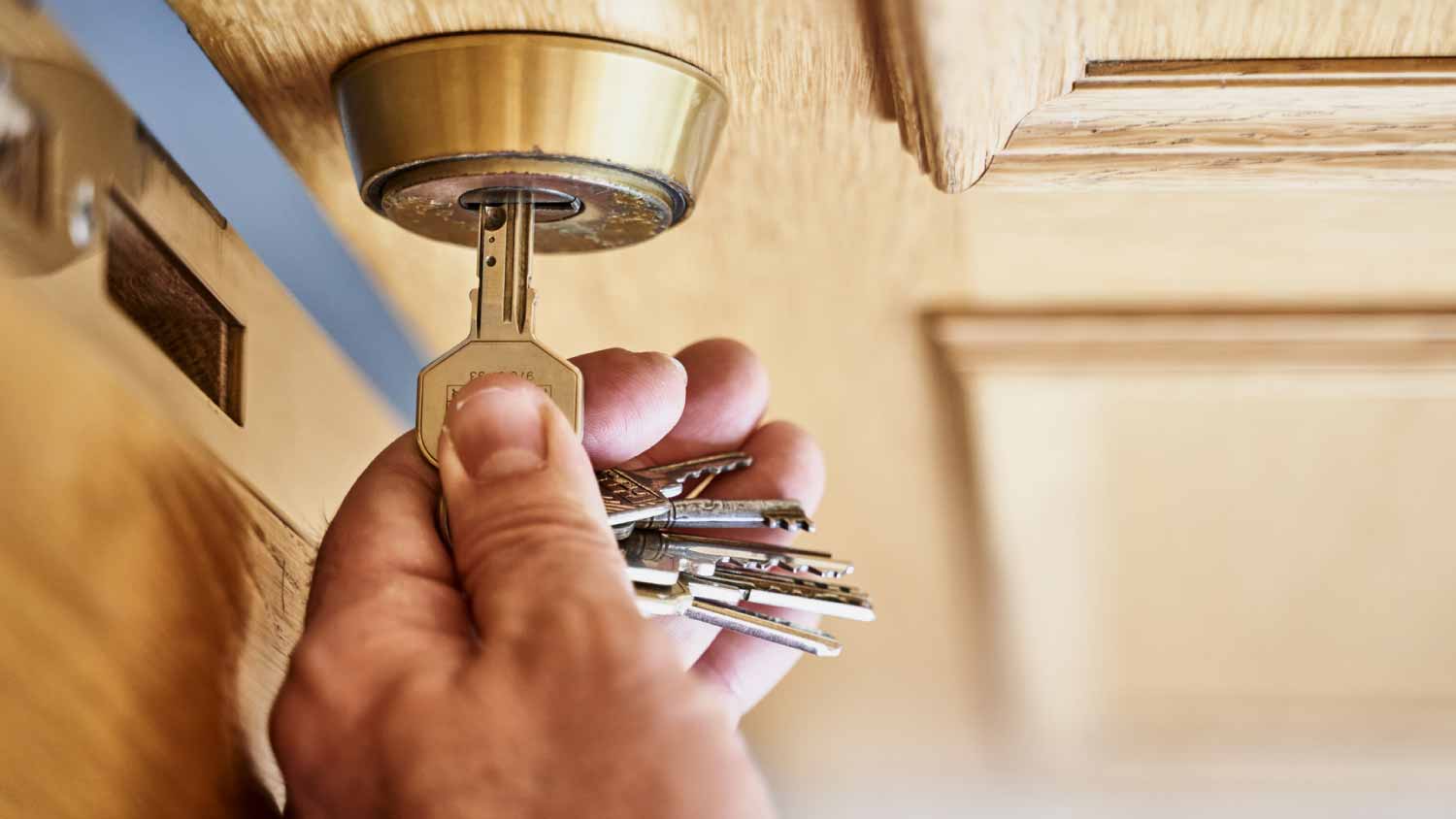 Man opening a wooden door