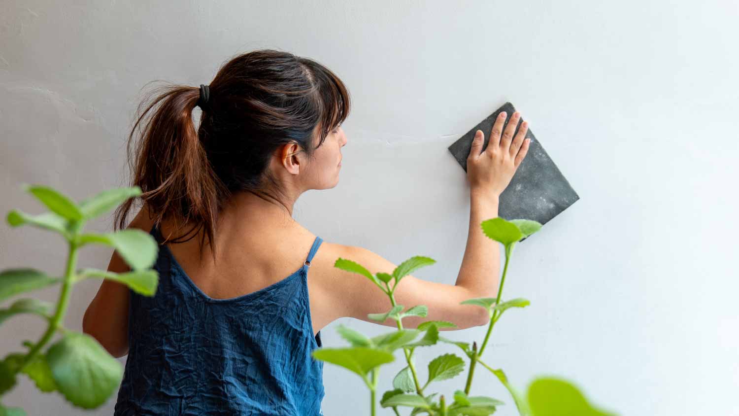 Woman using sandpaper