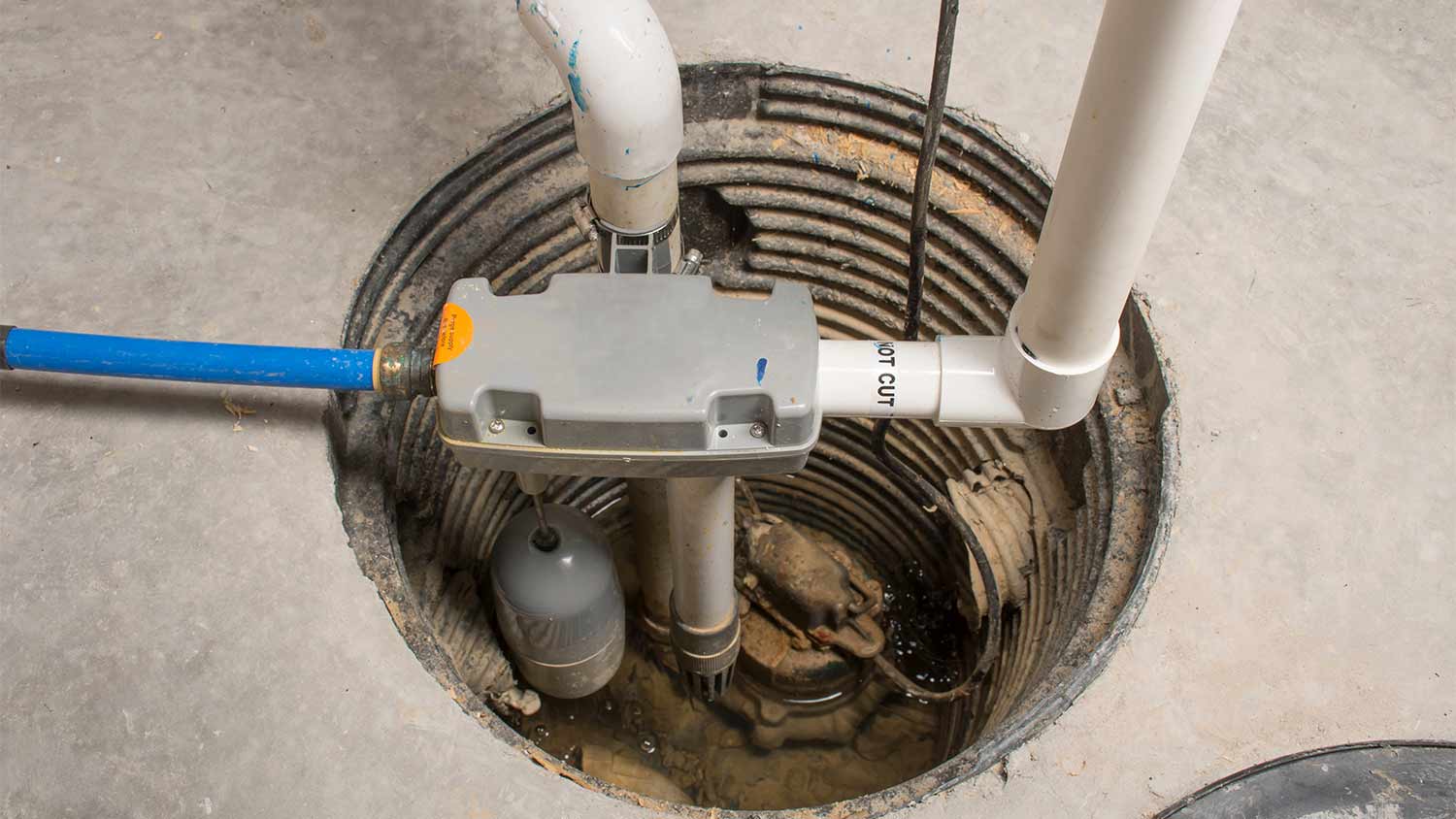 image of sump pump in basement