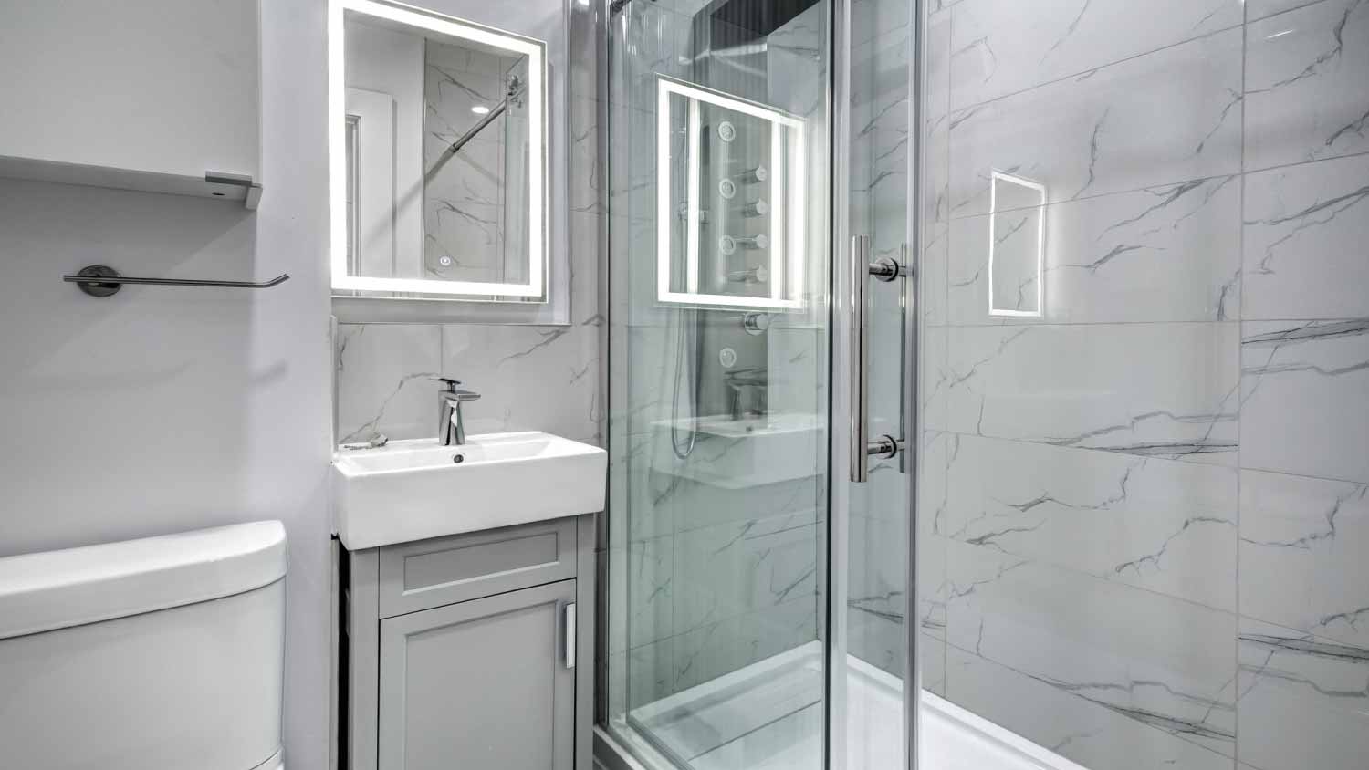 Bathroom with a sink and a shower