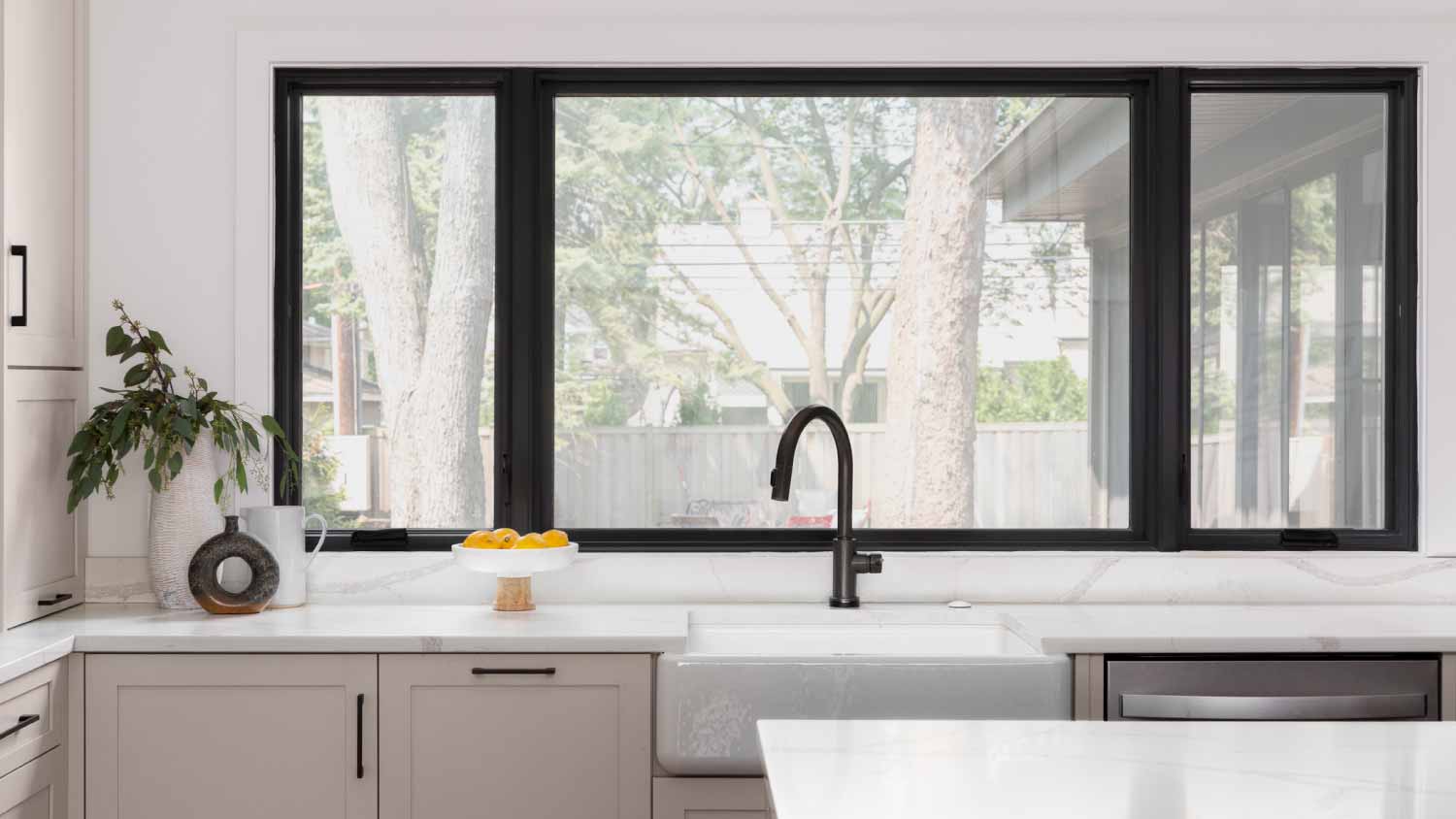 Black faucet on a farmhouse sink