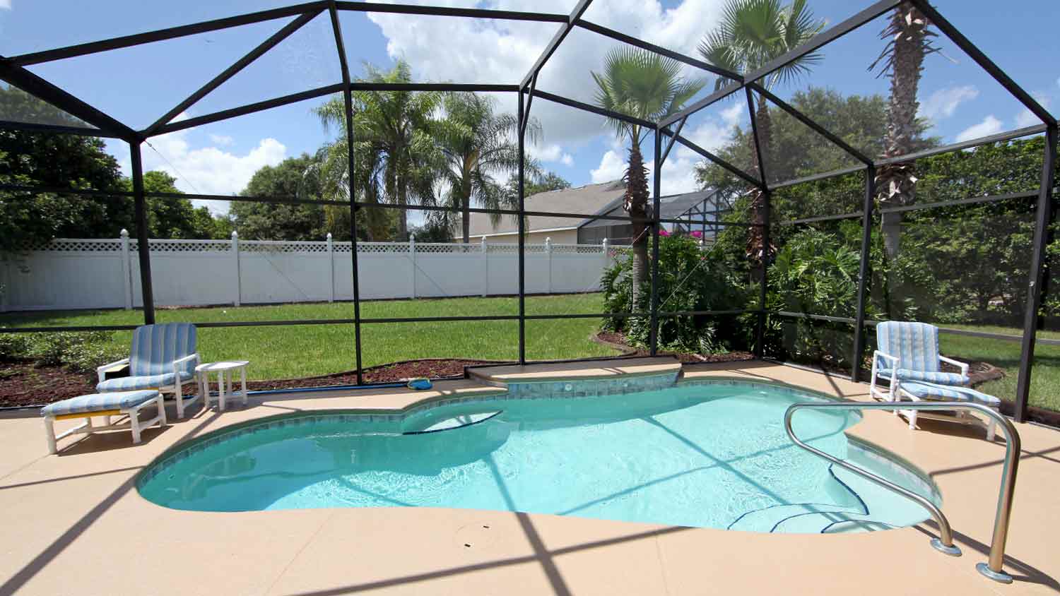 enclosed swimming pool in backyard