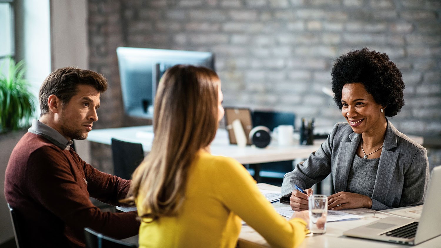 Couple meeting with a real estate agent