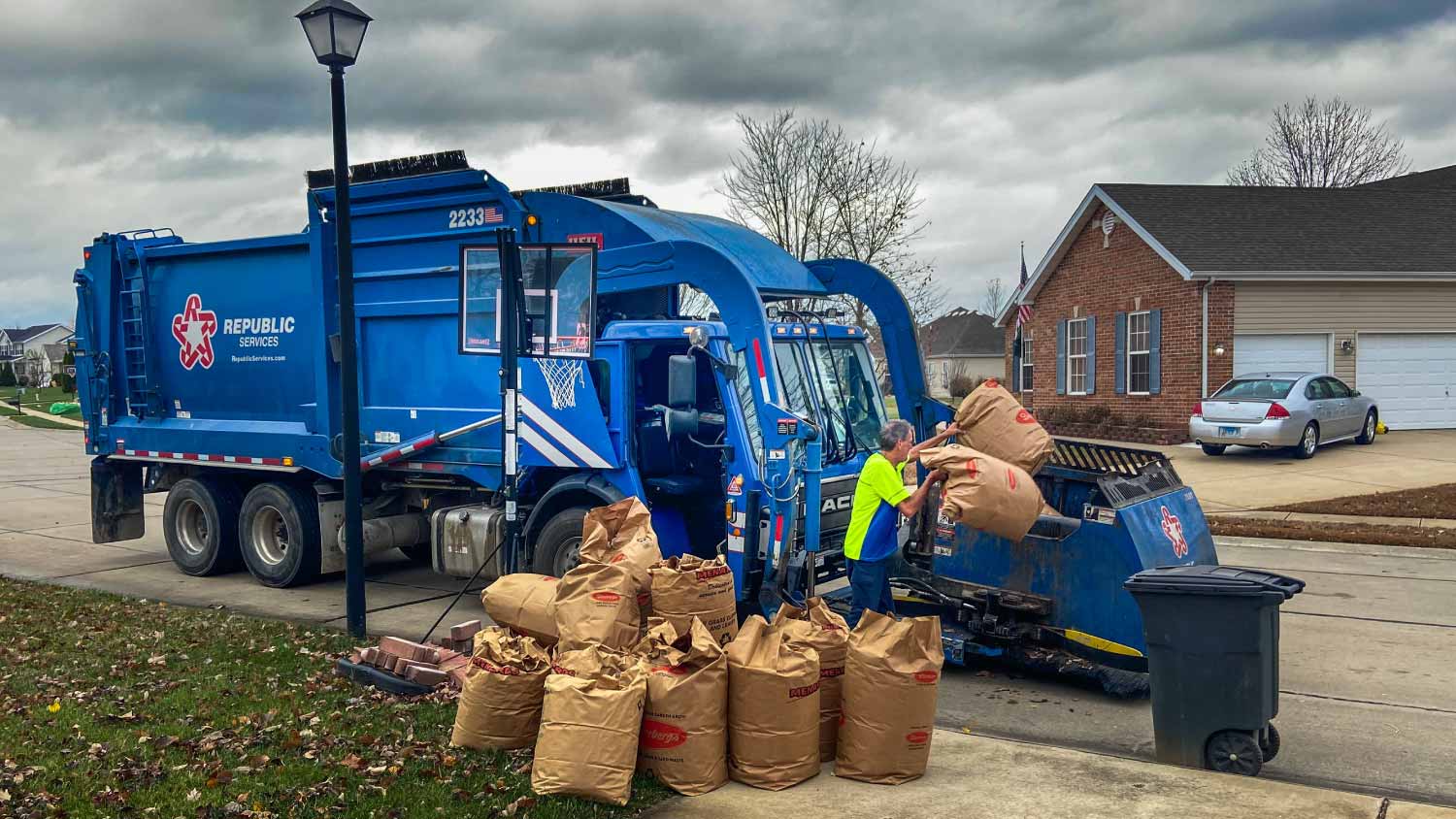 Driver picking up yard waste