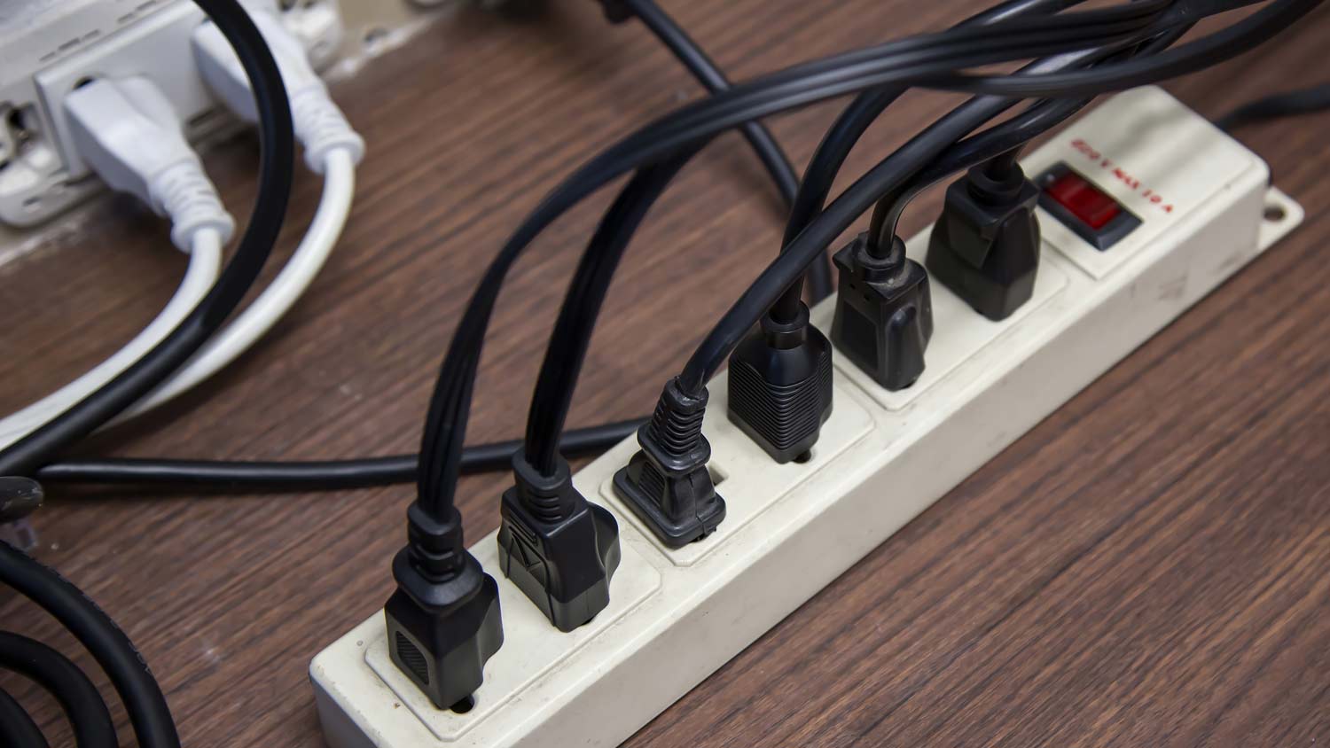 man removing plug from outlet