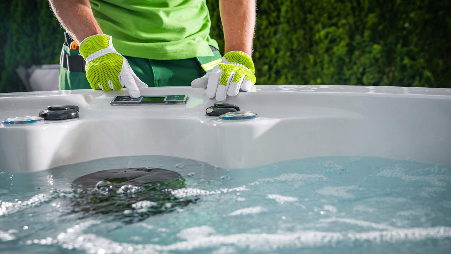 hot tub technician performing maintenance