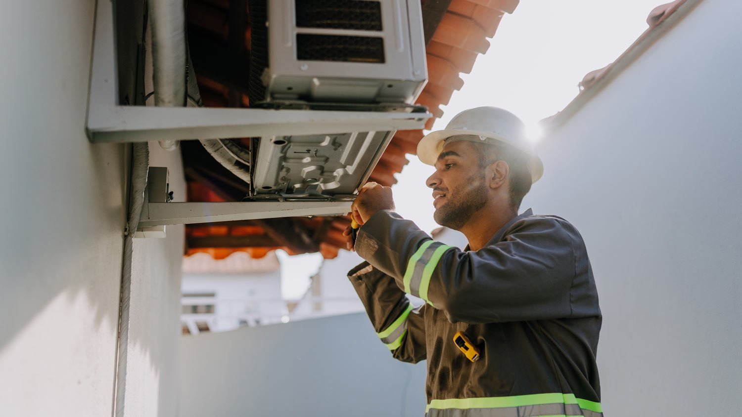 technician checking ac unit