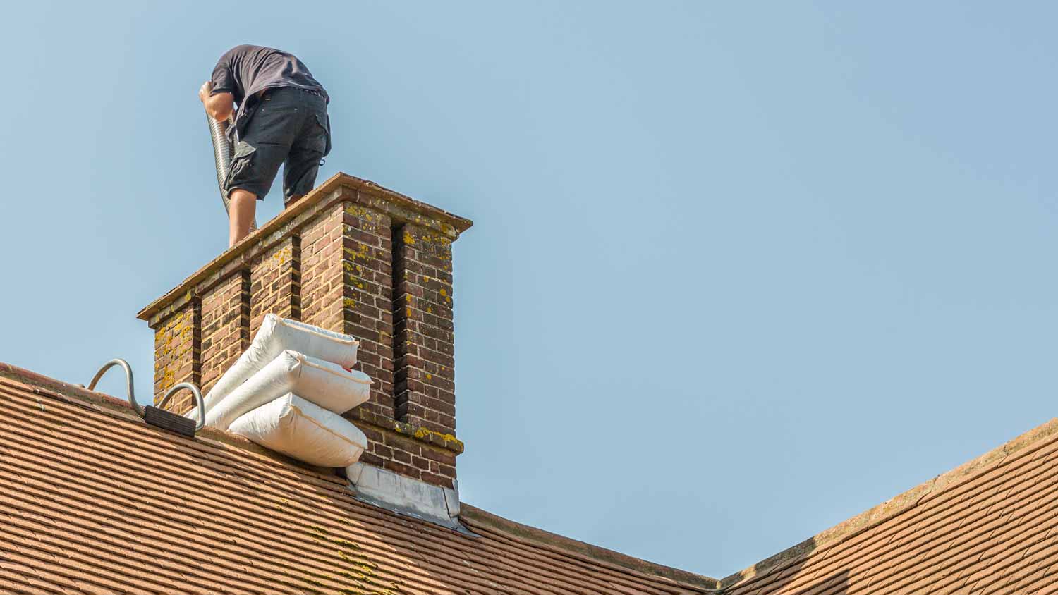 man installing chimney liner