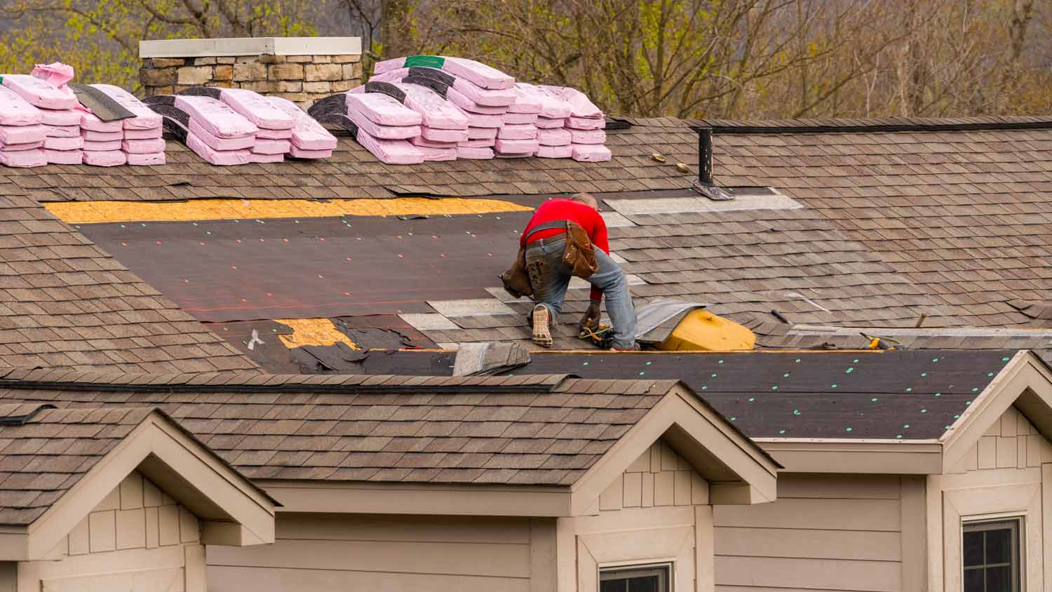 roof contractor installing new tiles