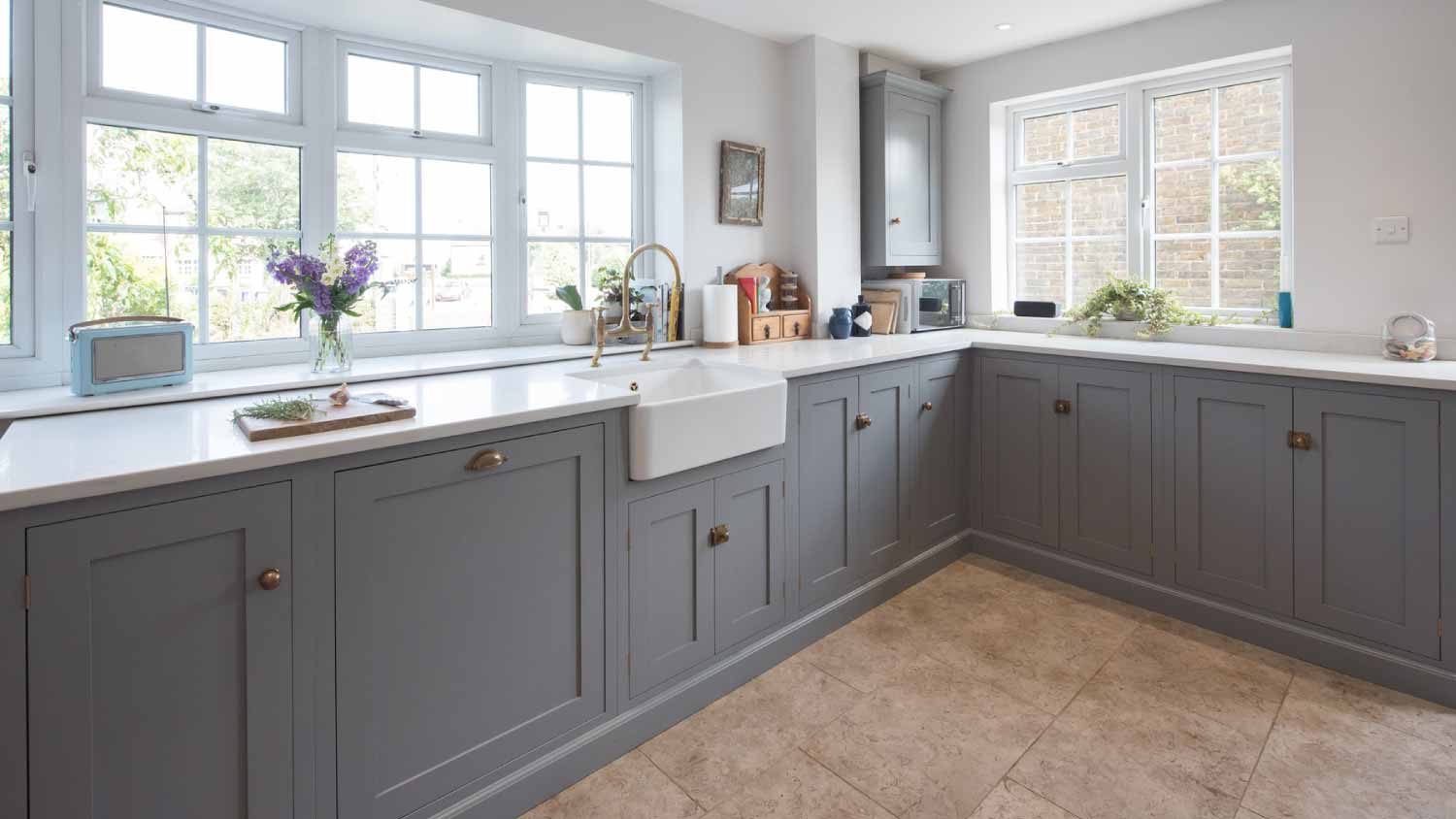 A interior view of kitchen with gray cabinets