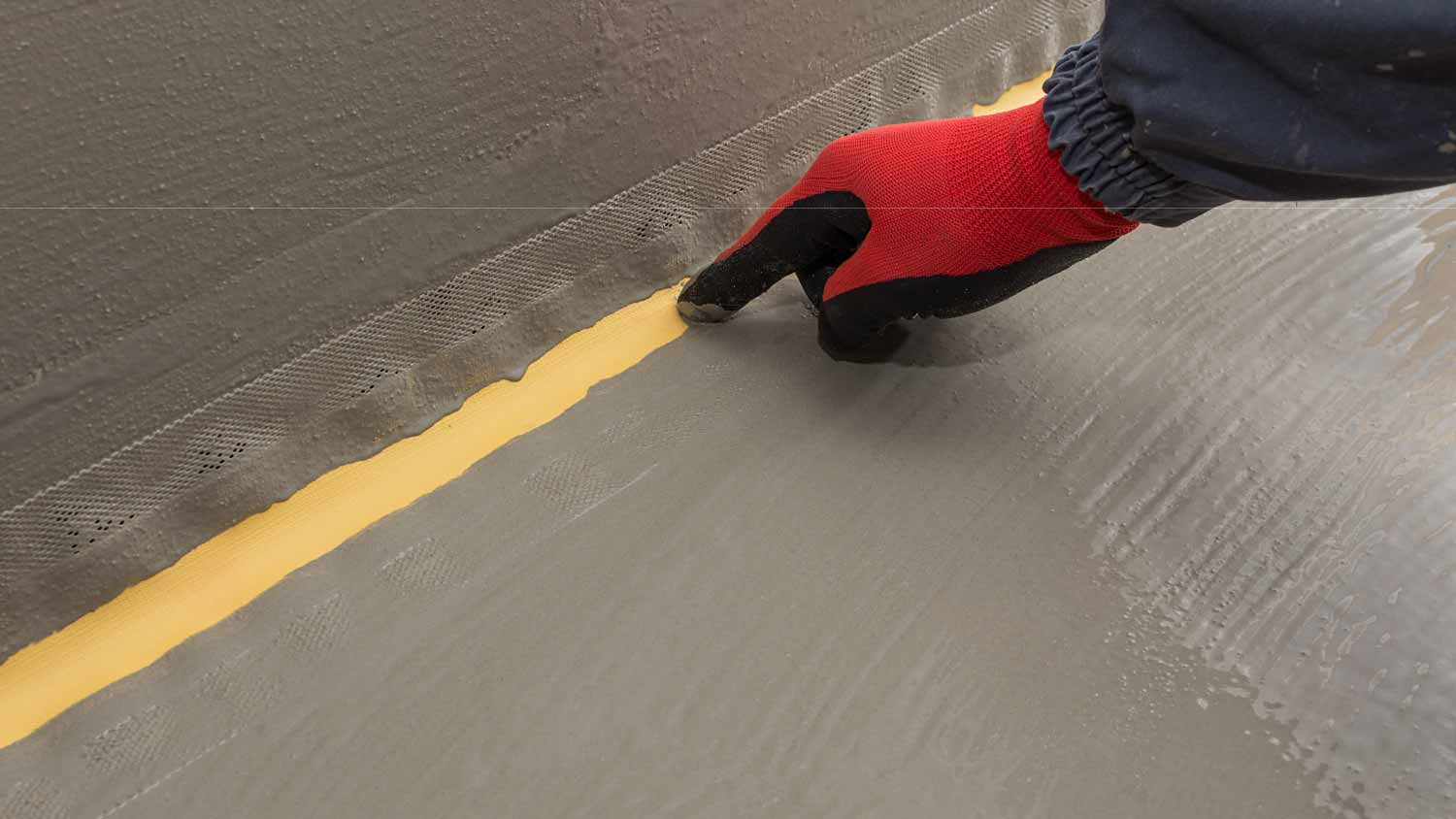 A man checking waterproof strip in the waterproofing system