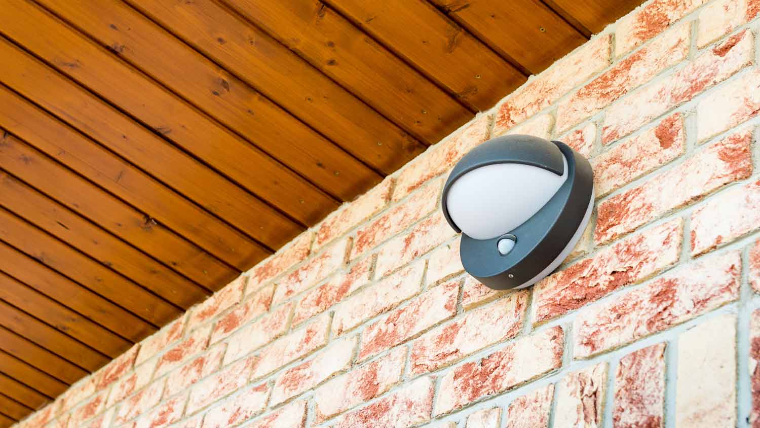 motion sensor light on brick wall 