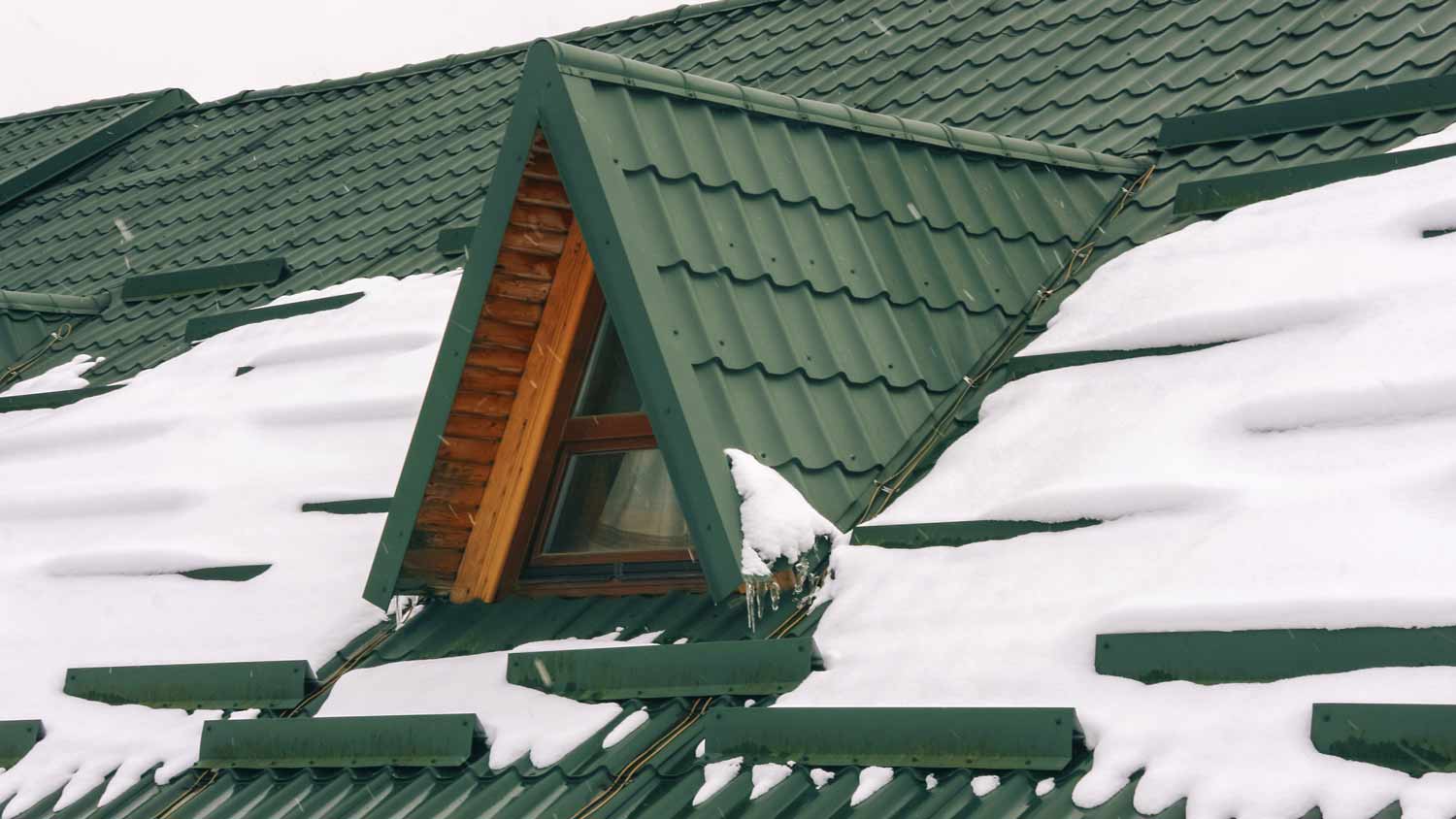 snow on tiled metal roof