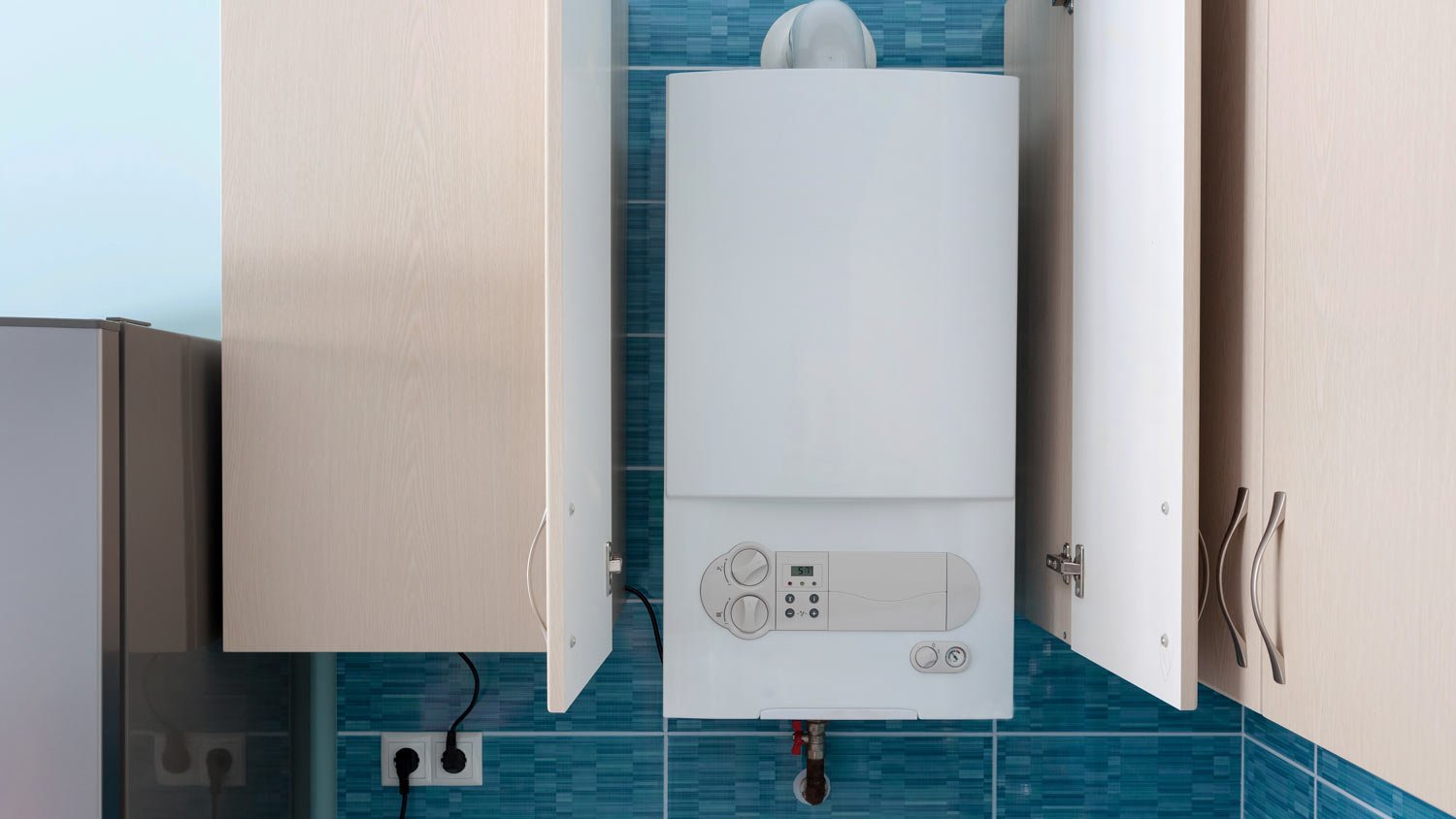 white boiler mounted on a wall